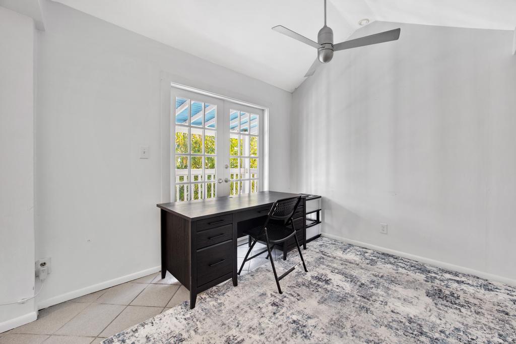 623 Thomas Street, Unit C Key West, FL 33040 - Photo 5 of 25 a workspace with furniture and a window