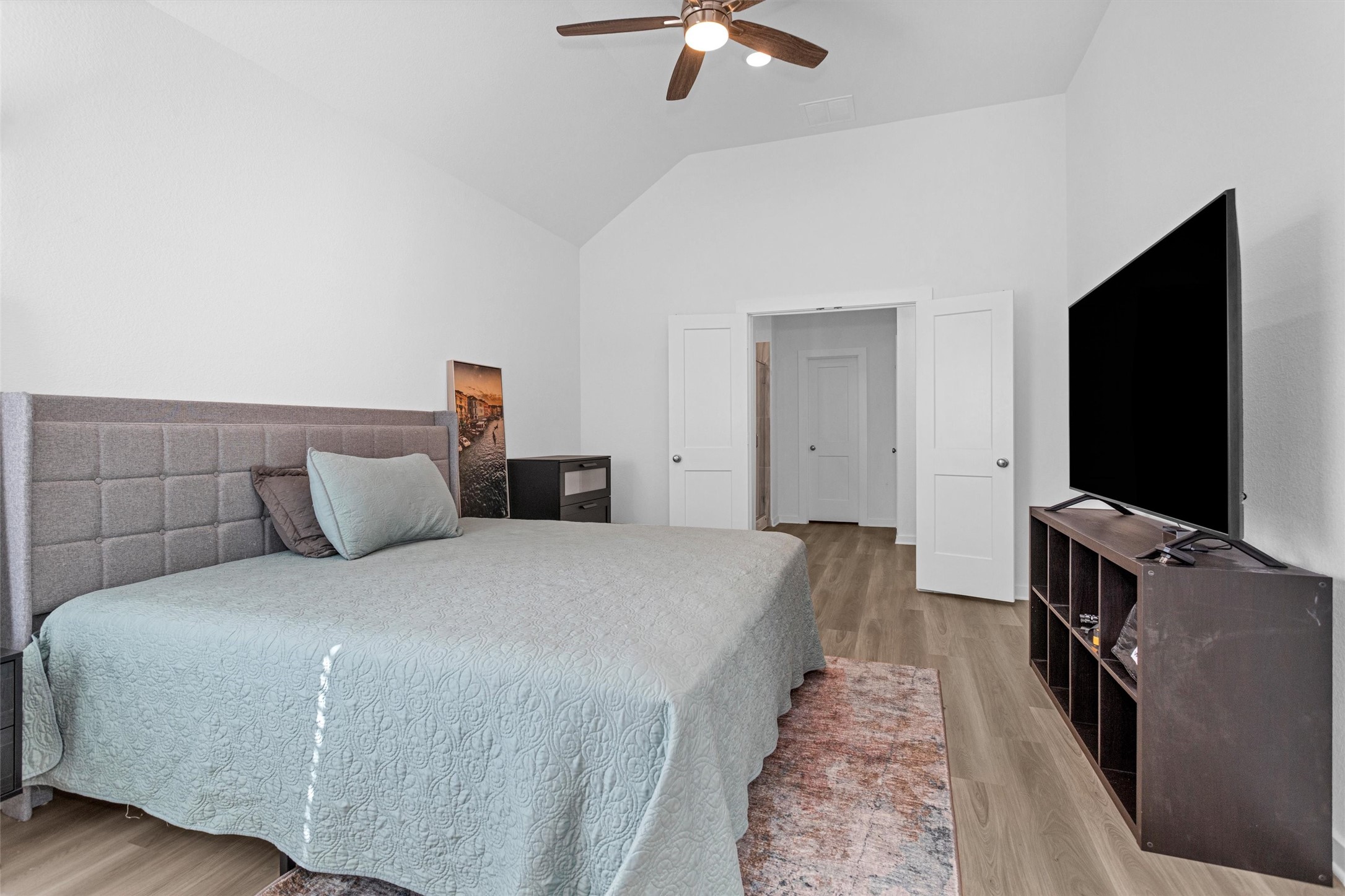 2127 Heather Rdg Way Rosenberg, TX 77471 - Photo 21 of 41 a bedroom with a bed and a flat screen tv