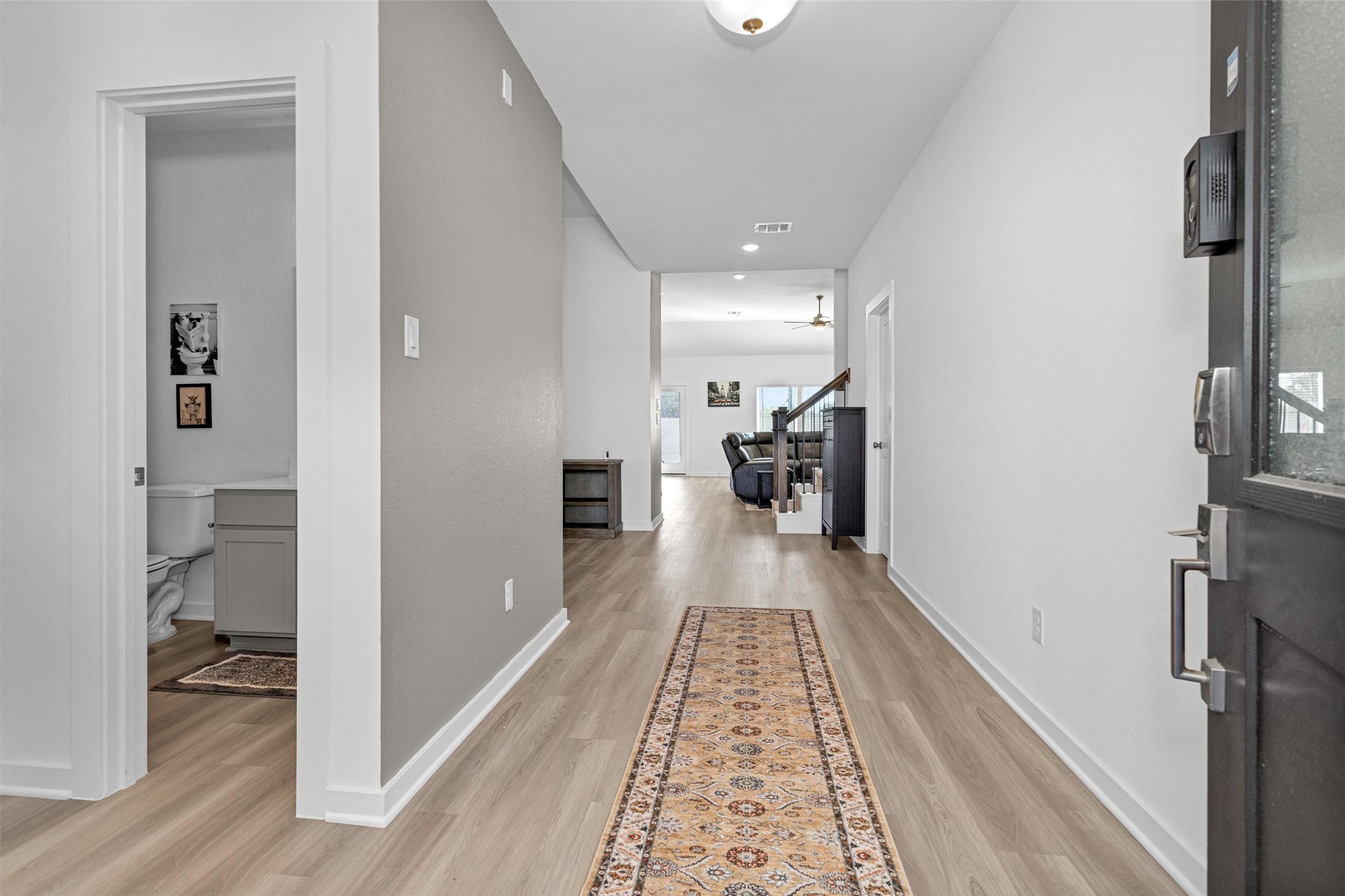 2127 Heather Rdg Way Rosenberg, TX 77471 - Photo 4 of 41 a view of hallway with wooden floor