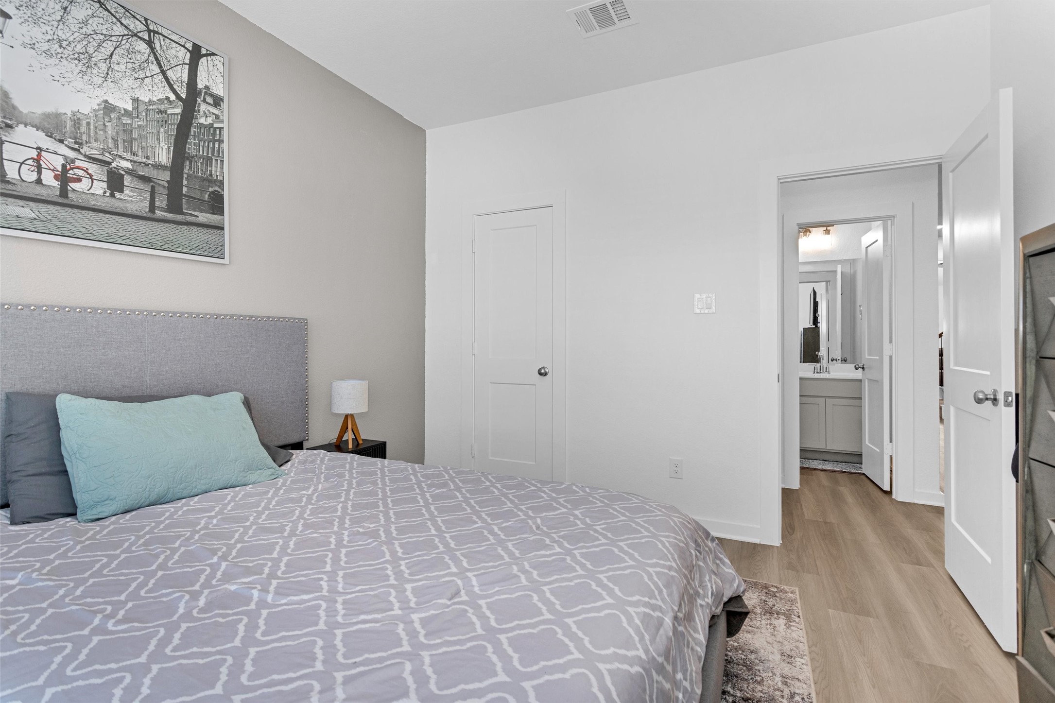 2127 Heather Rdg Way Rosenberg, TX 77471 - Photo 7 of 41 a bedroom with a bed and a painting on the wall