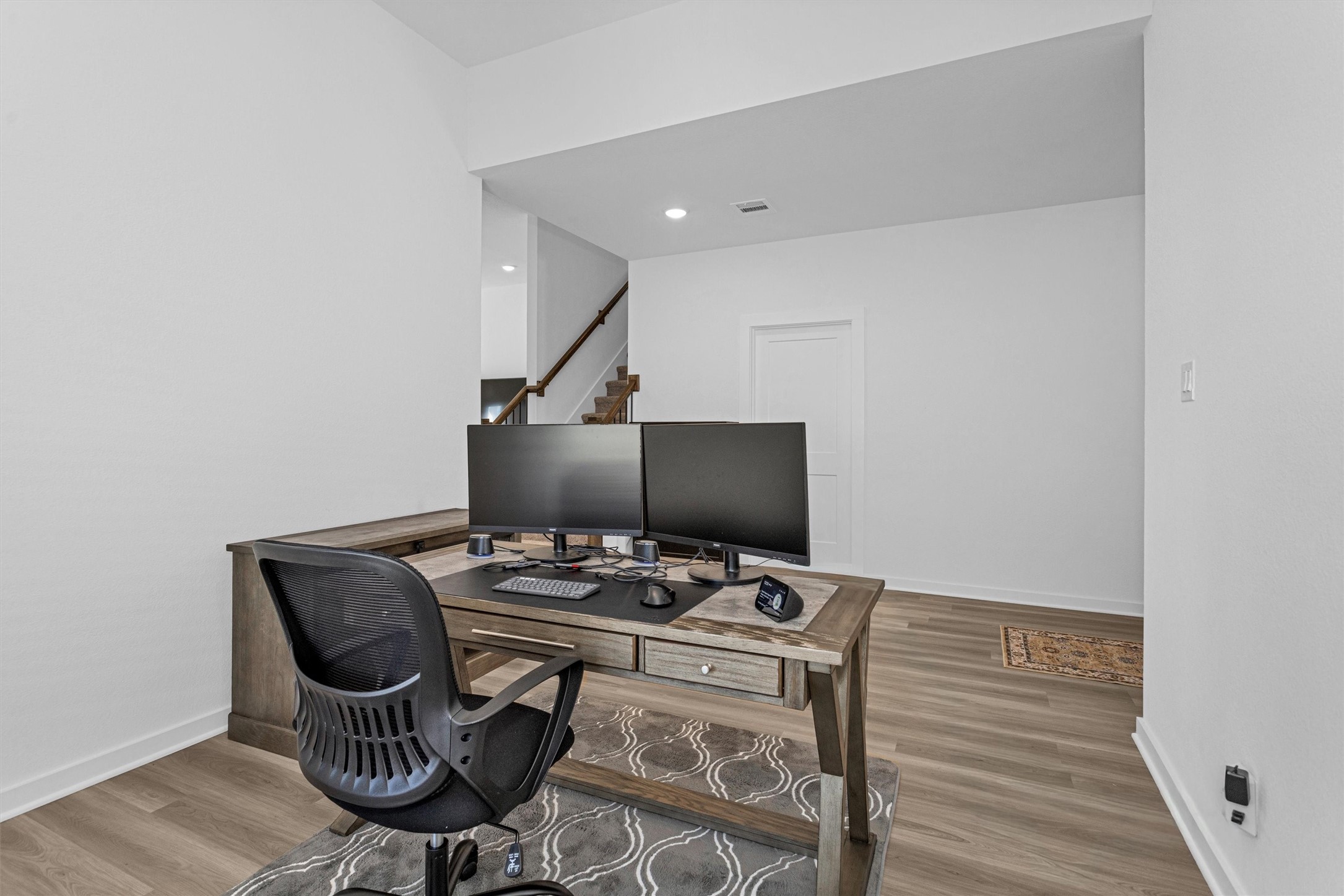 2127 Heather Rdg Way Rosenberg, TX 77471 - Photo 10 of 41 a workspace with furniture and wooden floor