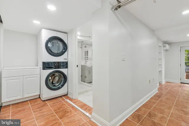 a view of a storage & utility room with a washer and dryer