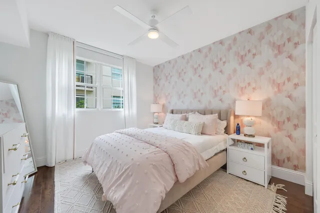 a bedroom with two beds and a dresser