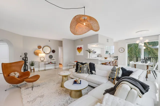 a living room with furniture and flat screen tv