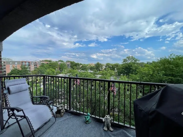 a view of a balcony with furniture