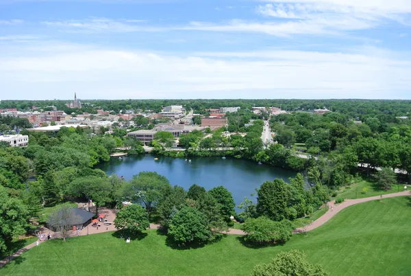 an aerial view of residential house with outdoor space and trees all around
