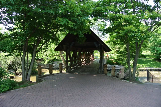 a view of patio with a table and chairs under an umbrella