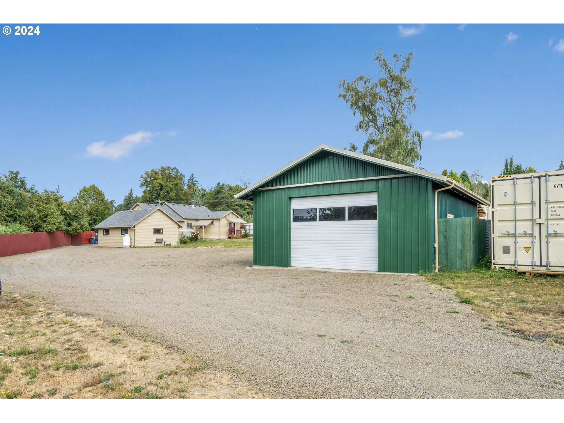 16985 Southeast Foster Road Gresham, OR 97080 - Photo 3 of 48 a front view of a house with a yard and garage