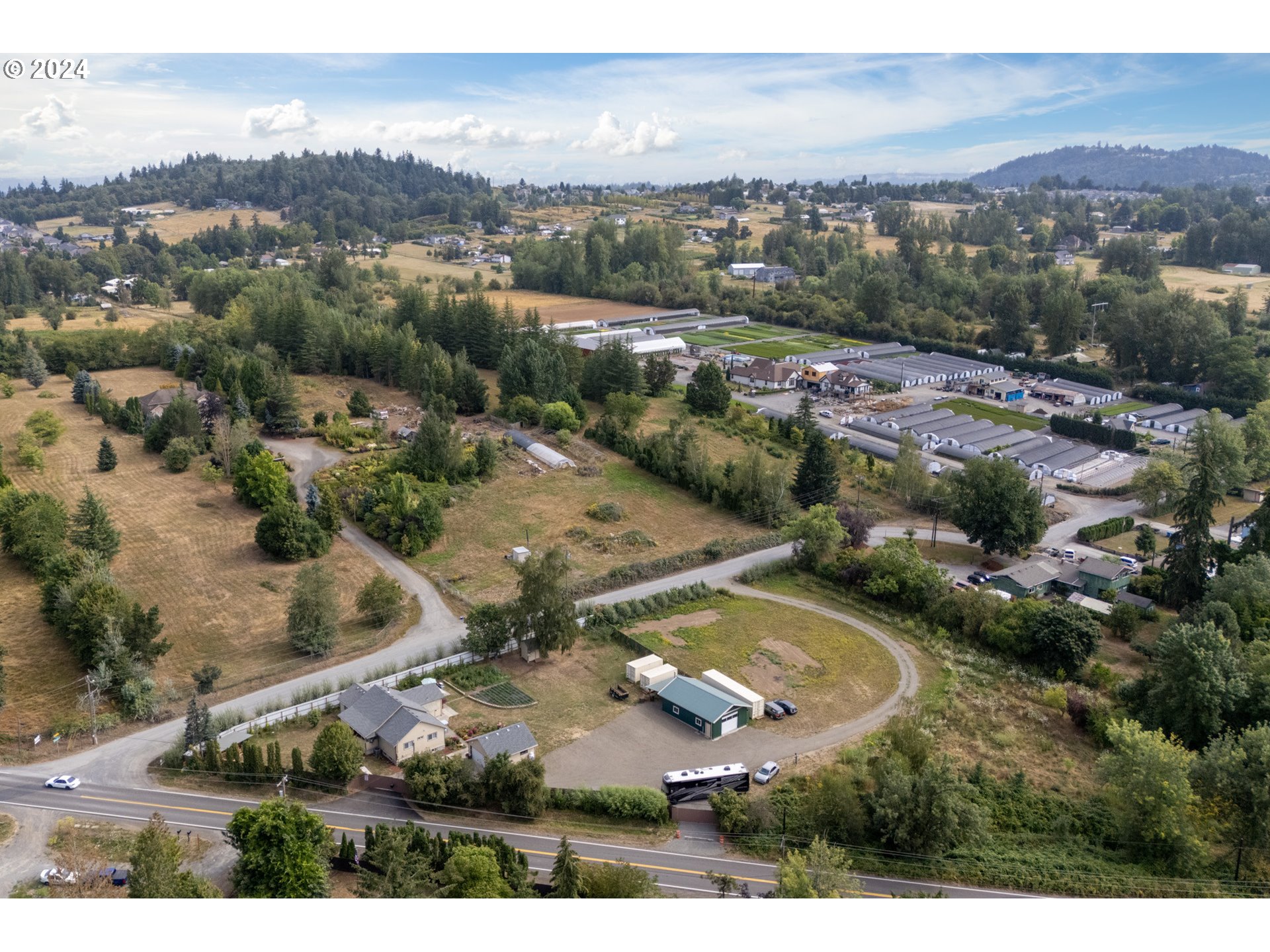 16985 Southeast Foster Road Gresham, OR 97080 - Photo 45 of 48 an aerial view of residential houses with outdoor space