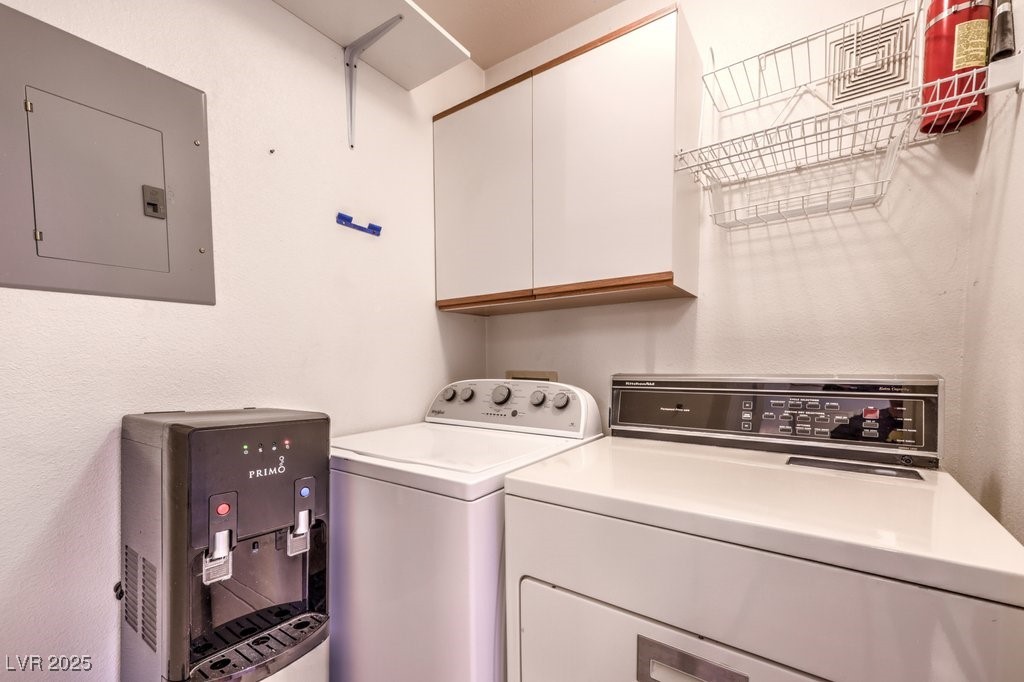 698 South Racetrack Road, Unit 1014 Henderson, NV 89015 - Photo 9 of 25 Washroom featuring electric panel, cabinet space, and washing machine and clothes dryer