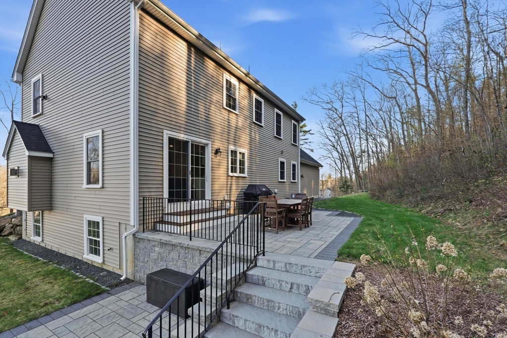 103 Rice Corner Road Brookfield, MA 01506 - Photo 32 of 39 a view of house with patio and outdoor seating