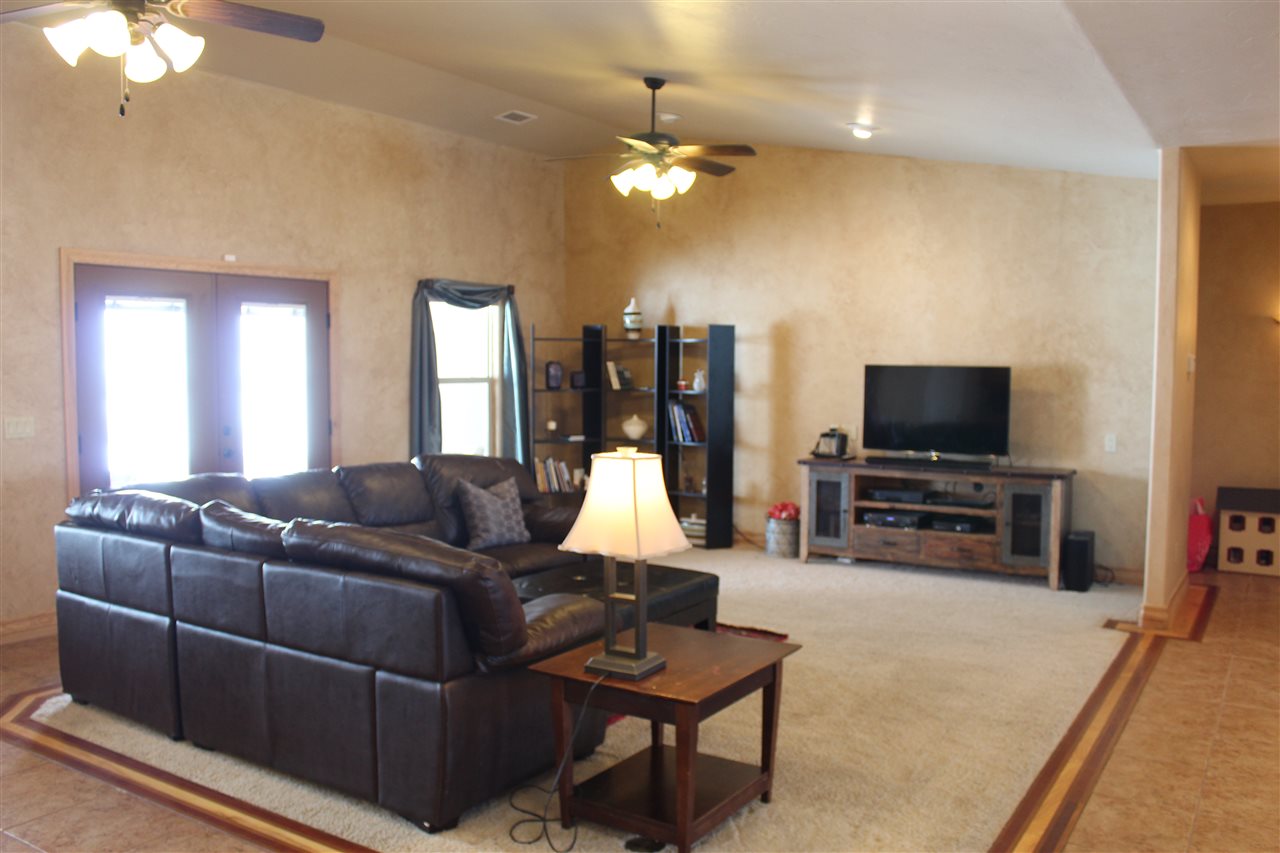 823 Mease Road Grand Junction, CO 81505 - Photo 5 of 26 a living room with furniture and a flat screen tv