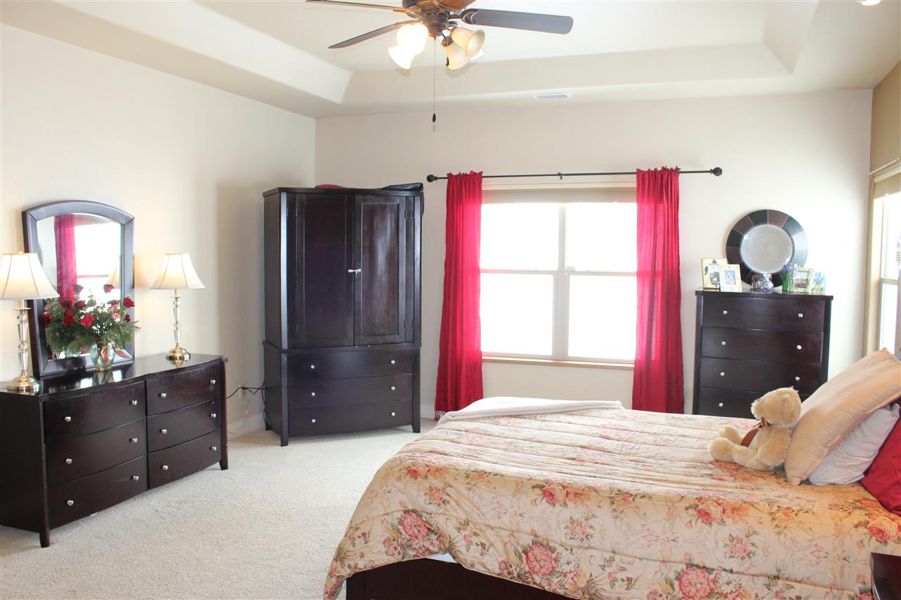 823 Mease Road Grand Junction, CO 81505 - Photo 8 of 26 a bedroom with a bed and a dresser