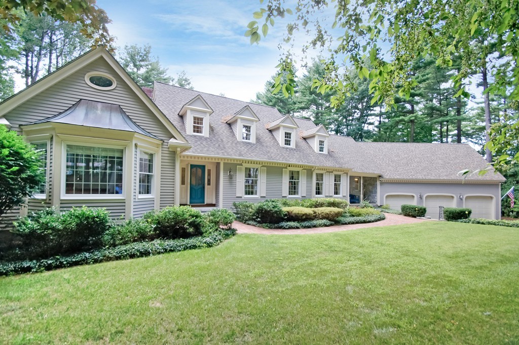 171 West Bare Hill Road Harvard, MA 01451 - Photo 1 of 30 a front view of a house with a yard and garage