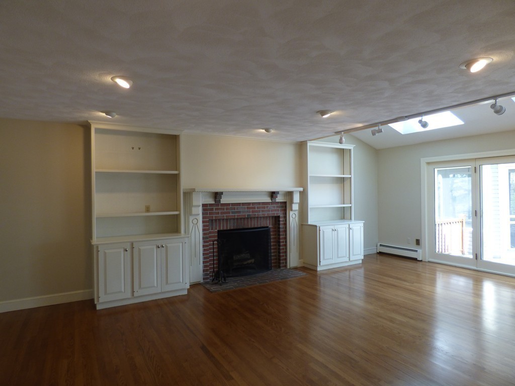 171 West Bare Hill Road Harvard, MA 01451 - Photo 11 of 30 a view of an empty room with a fireplace and a window