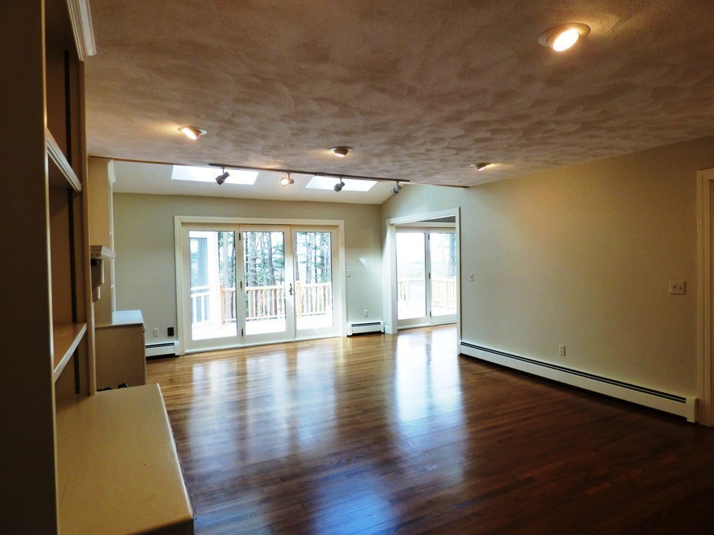 171 West Bare Hill Road Harvard, MA 01451 - Photo 13 of 30 a view of an empty room with wooden floor and a window