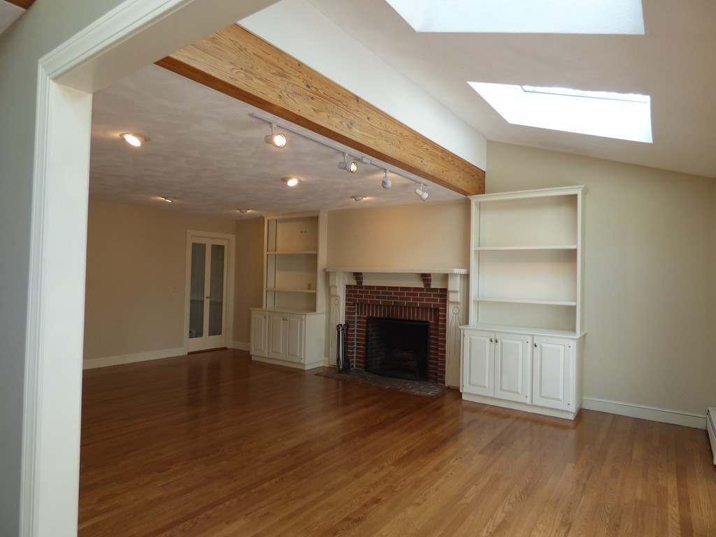 171 West Bare Hill Road Harvard, MA 01451 - Photo 14 of 30 a view of an empty room with wooden floor fireplace and a window