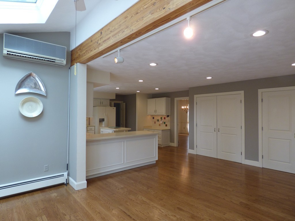 171 West Bare Hill Road Harvard, MA 01451 - Photo 18 of 30 a view of a living room a kitchen and a wooden floor
