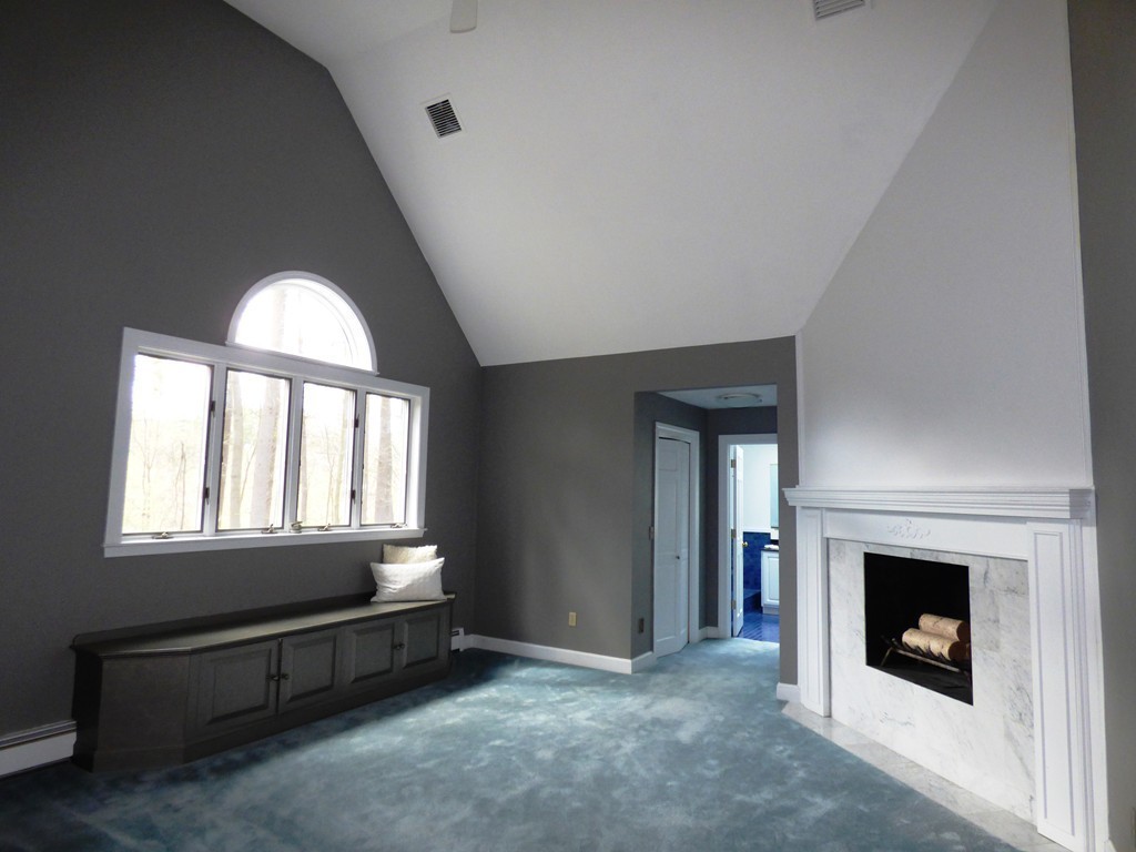 171 West Bare Hill Road Harvard, MA 01451 - Photo 19 of 30 a view of an empty room with a fireplace and a window
