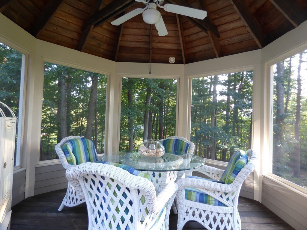 171 West Bare Hill Road Harvard, MA 01451 - Photo 28 of 30 a dining room with furniture large windows and wooden floor