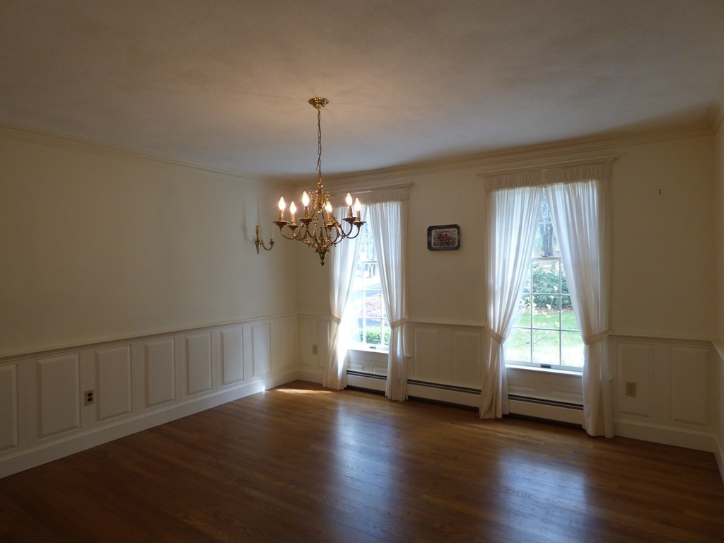 171 West Bare Hill Road Harvard, MA 01451 - Photo 6 of 30 a view of a livingroom with a chandelier wooden floor and windows