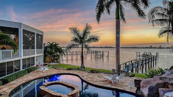 a table and chairs sitting in front of a house