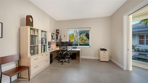 a work room with furniture and a window