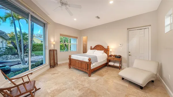 a bedroom with a bed and a couch