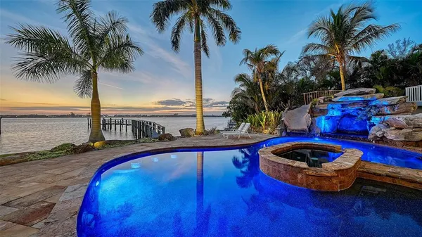 a view of outdoor space with swimming pool and patio
