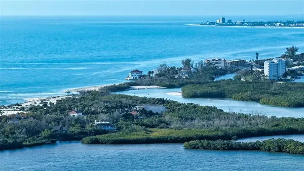 a view of a city with an ocean view
