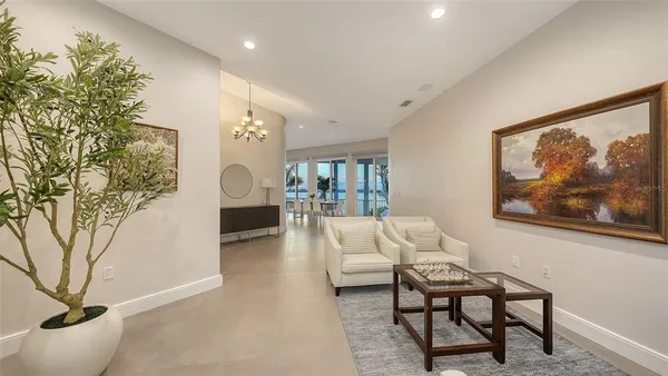 a living room with furniture and a clock