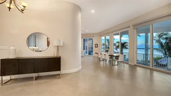 a living room with furniture a window and a table