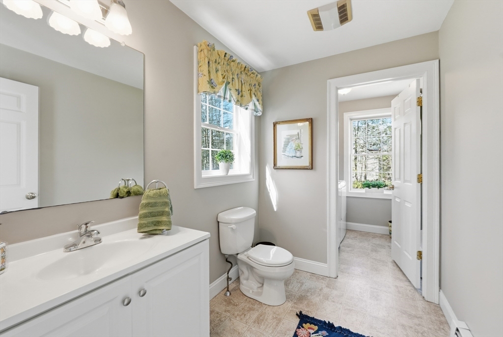 331 East County Road Rutland, MA 01543 - Photo 15 of 37 a bathroom with a sink a toilet and window