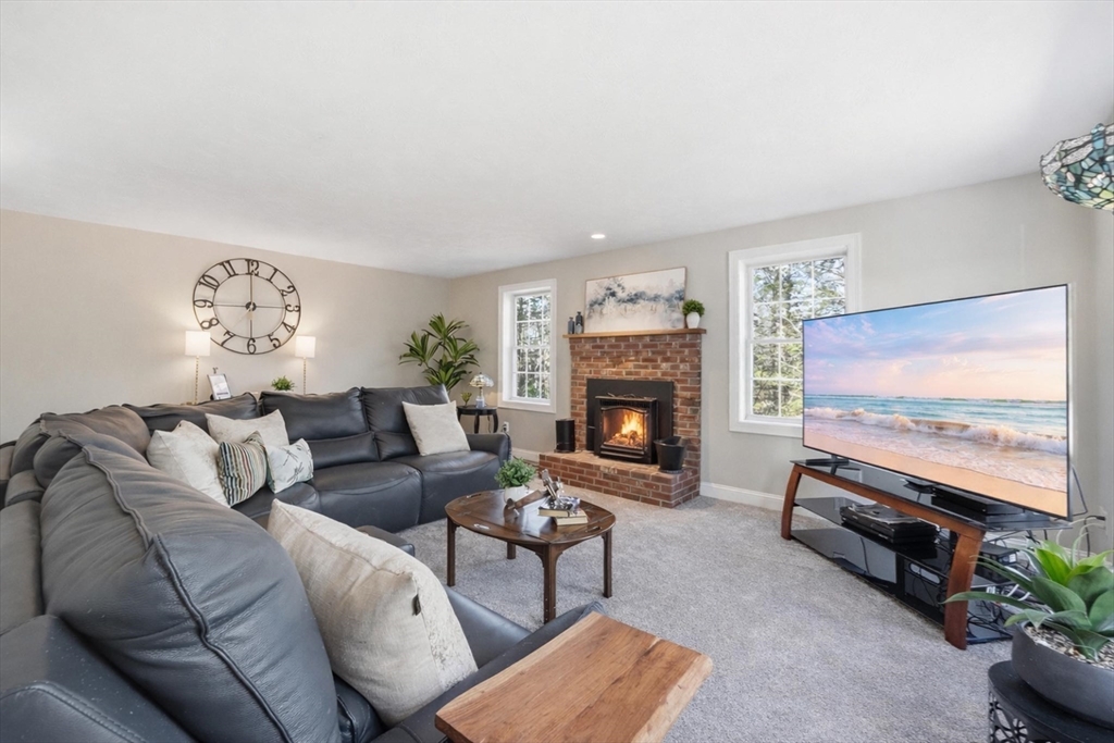 331 East County Road Rutland, MA 01543 - Photo 10 of 37 a living room with furniture a flat screen tv and a fireplace