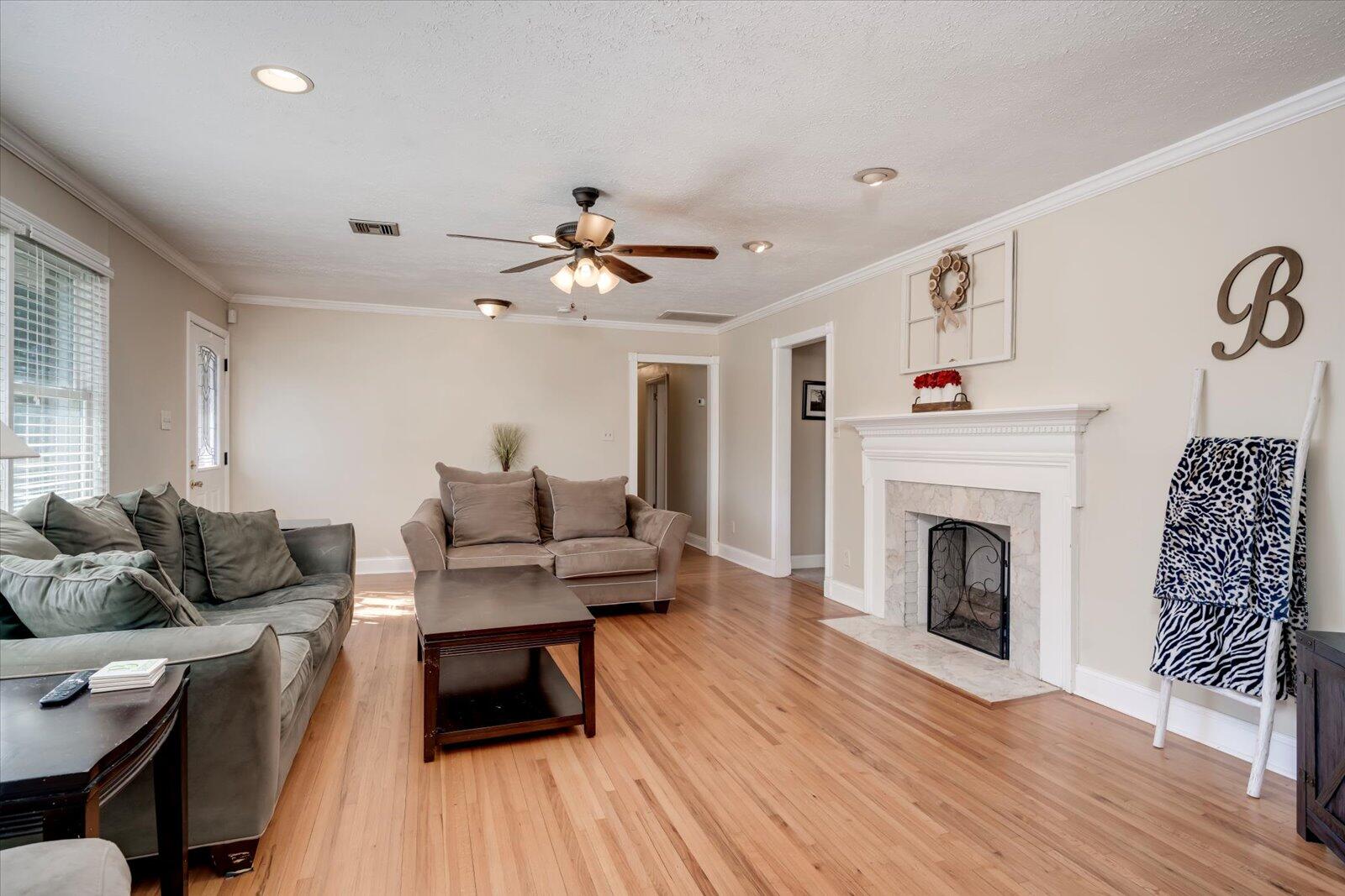 2945 Wagener Road Aiken, SC 29801 - Photo 3 of 47 a living room with furniture and a fireplace