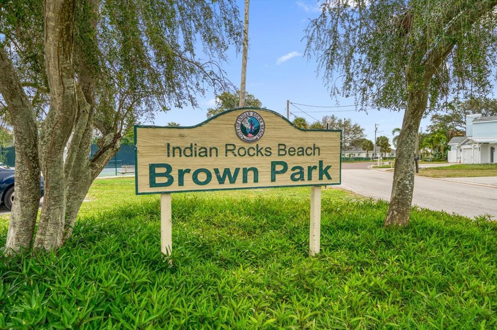2704 2nd Street, Unit 14 Indian Rocks Beach, FL 33785 - Photo 19 of 21 a sign of golf club on a wall under a tree
