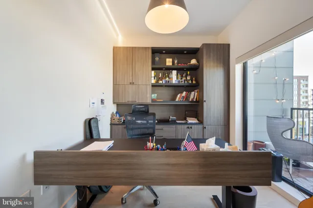 a room with a table chairs and a wooden floor