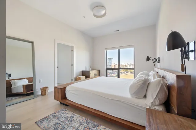 a bedroom with a bed and window