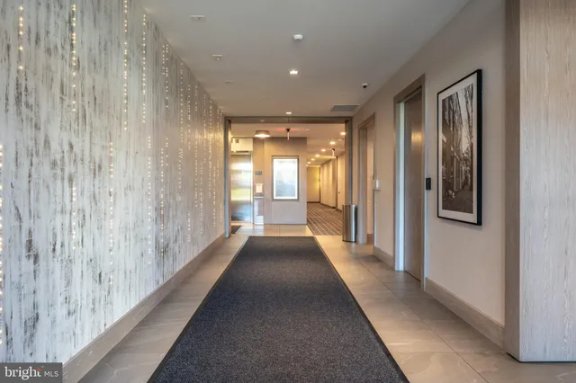 a view of a hallway with windows