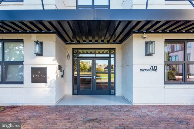 a view of an empty room with a fireplace