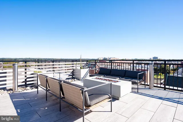 a kitchen with a sink cabinets and wooden floor