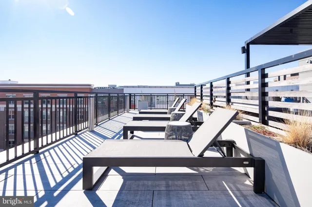 a view of a balcony with chairs