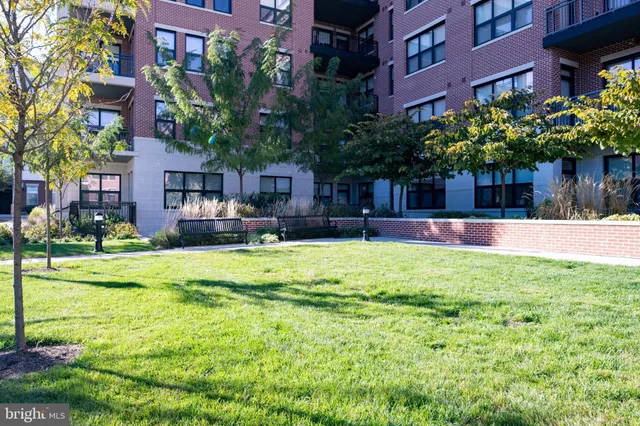 a view of a building with a yard