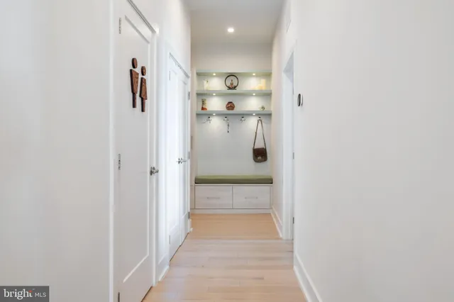 a view of a hallway with shelves