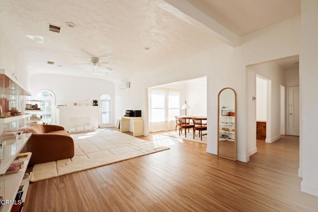 5166 Packard Street Los Angeles, CA 90019 - Photo 12 of 31 a living room with furniture and wooden floor