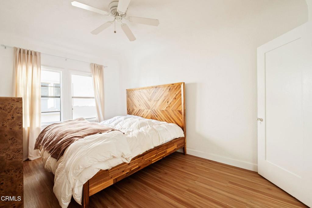 5166 Packard Street Los Angeles, CA 90019 - Photo 14 of 31 a bedroom with a bed and window