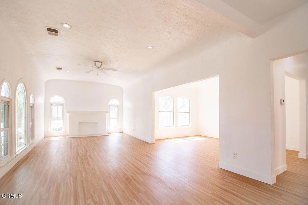 5166 Packard Street Los Angeles, CA 90019 - Photo 21 of 31 a view of empty room with wooden floor and fan