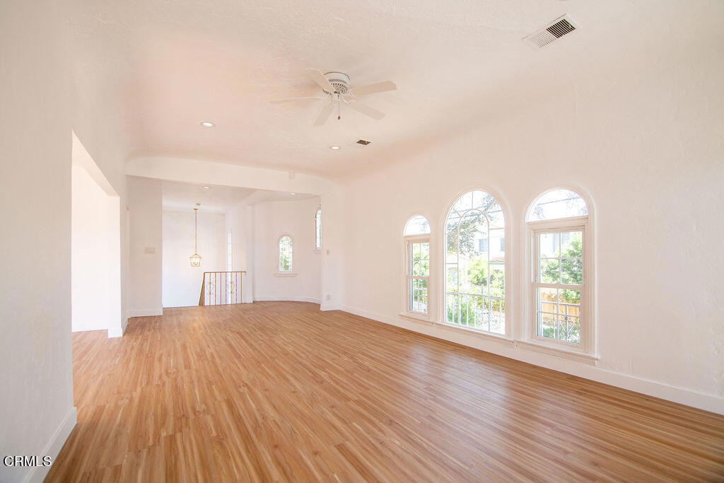 5166 Packard Street Los Angeles, CA 90019 - Photo 24 of 31 a view of an empty room with wooden floor and a window