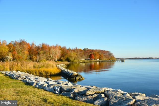 3206 Lynch Road Baltimore, MD 21219 - Photo 56 of 70 a view of a lake with lawn chairs