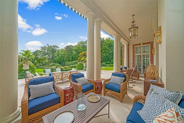 a view of patio with couches and pool